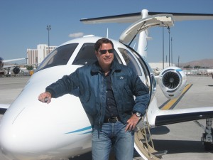John Travolta takes in the sights at the Reno National Championship Air Races and Air Show 2007 in front of his new Eclipse 500.