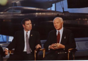 On Dec. 17, 2002, Senator John Glenn (right) joined with actor and aviator John Travolta, master of ceremonies, to kick off a yearlong commemoration honoring the 100th anniversary of the Wright brothers’ first powered flight.