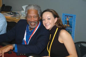 Morgan Freeman gives Linsey Lips some tips during a card game at the 3rd annual Living Legends of Aviation at Airport Journals offices.