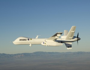 With smoke from the Lake Arrowhead area fires streaming in the background, NASA's Ikhana heads out on a Southern California wildfire imaging mission. The UAV reduces the risk to human pilots to zero.