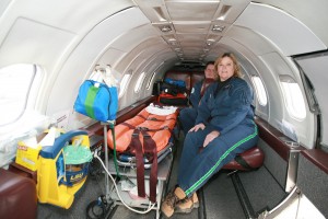 Flight nurses Julia Spring and Mike Owens demonstrate the cozy intensive care unit of the AASI Lear 35 medical transport jet.