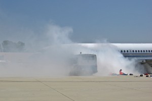 A B-727 aircraft is on fire following the simulated crash.