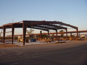 Lots of steel is being erected at Falcon Field, as Desert Jet Center’s extensive hangar facilities join retail outlets and other business development at the growing airport.