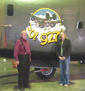 B-24 and B-29 squadron leader Lyn Fite (left) and CAF executive Wendy Stoneman pose next to Ol 927 nose art on the B-24 Liberator.