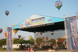 Balloons drift behind the large festival bandstand.