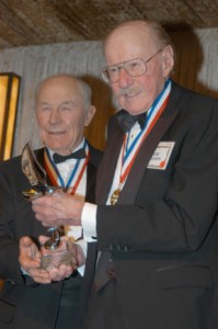 Bob Hoover (R) accepts the Freedom of Flight Award on 2005, from fellow Living Legend of Aviation General Chuck Yeager.