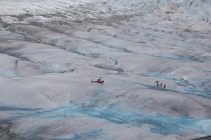 As the helicopter flew closer to the base camp, the ice revealed itself as small but rugged hills with a strange aqua-blue glow in parts.