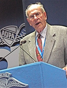 Paul Poberezny, founder of the Experimental Aircraft Association (EAA), addresses the audience of the opening day luncheon.