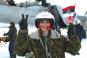 Pavlovich holds the three flags of her birth country, her host country and her homeland after reaching an altitude of 86,000 ft. in a MiG 25 in 2004. She is the first person of Yugoslavian origin to reach that altitude.